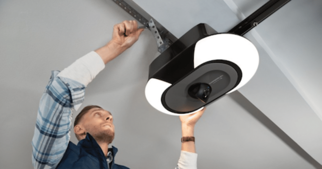 man fixing garage door opener
