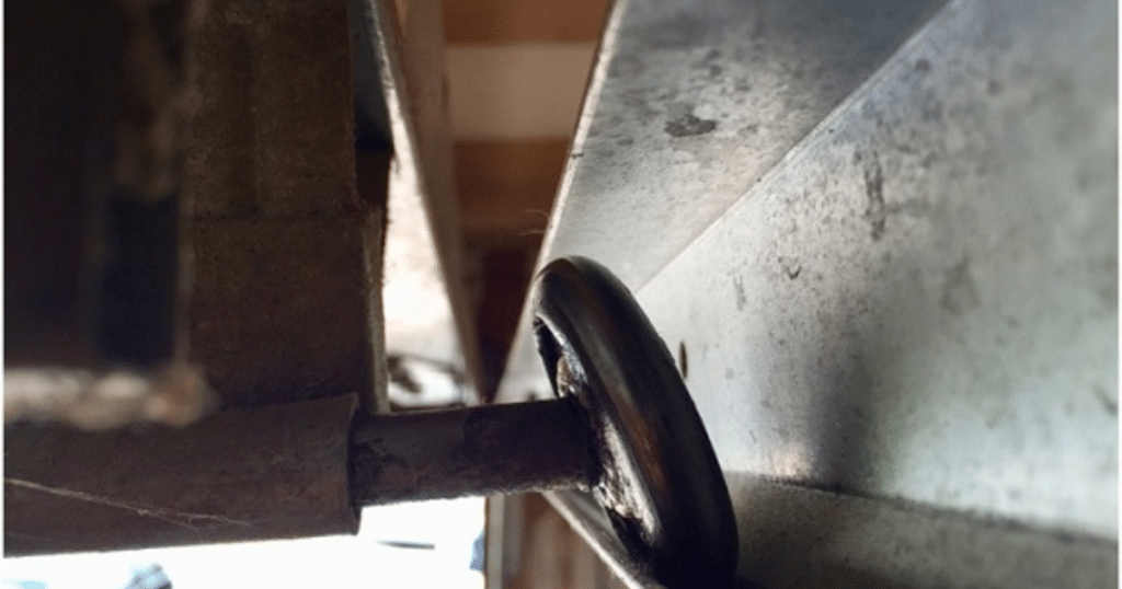 Garage door roller off the metal track.