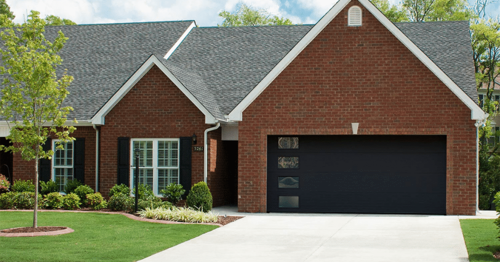 black garage doors on red brick house