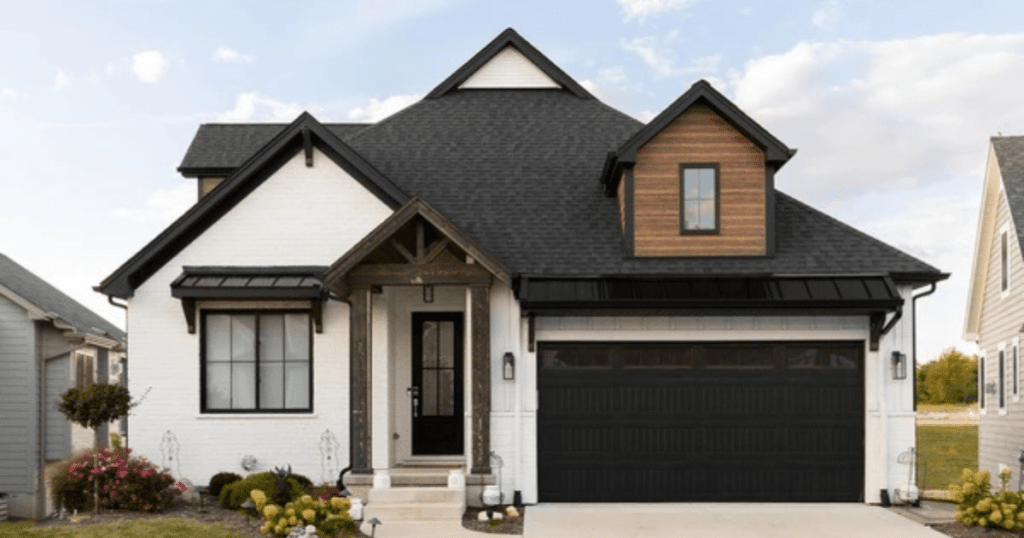 black garage door in a white house